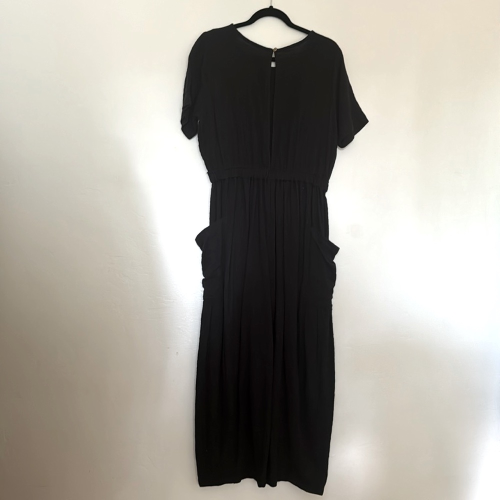 Free people medium one piece faded black jumper.